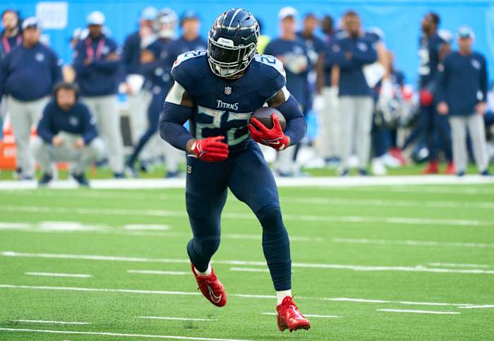 Oct 15, 2023; London, United Kingdom; Tennessee Titans running back Derrick Henry (22) runs in for a touchdown during the second half of an NFL International Series game at Tottenham Hotspur Stadium.
